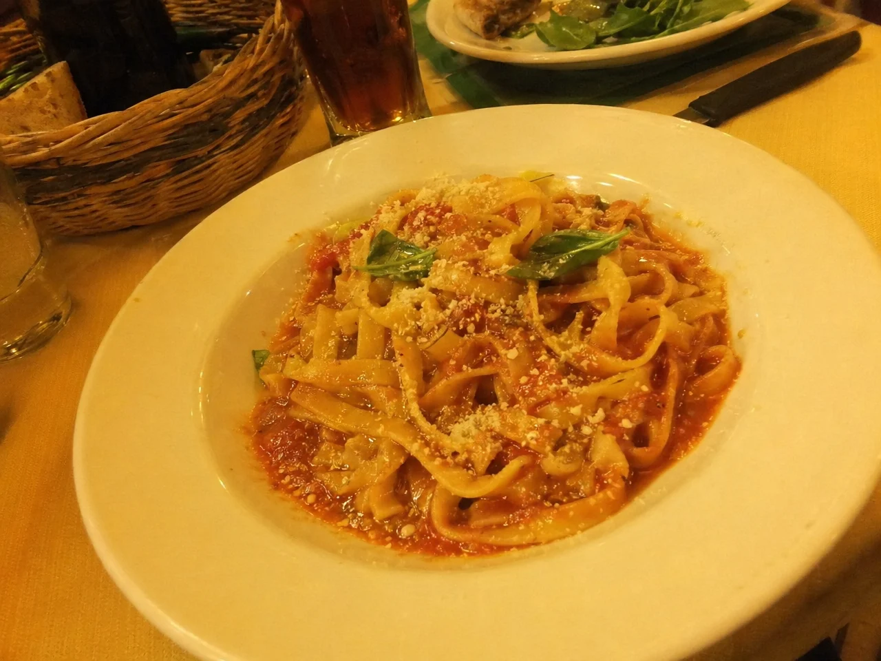 Amateur phone photo of a pasta dish before AI enhancement